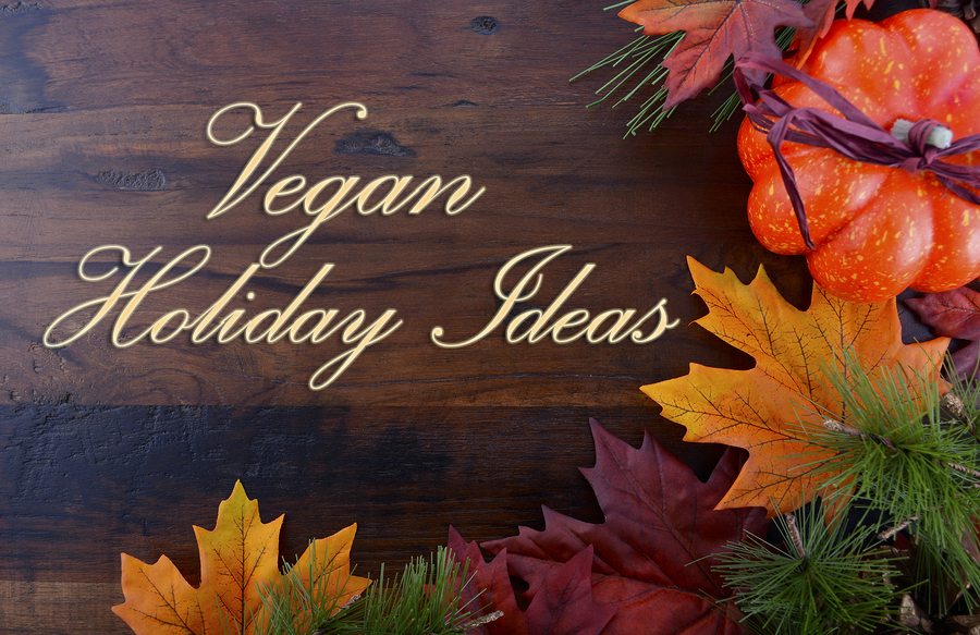 Autumn Fall background for Thanksgiving or Halloween with leaves and decorations on rustic wood table with copy space for your text here.